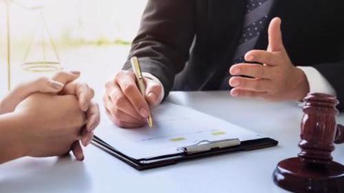 An attorney reviewing a Paragard IUD injury claim with a client.